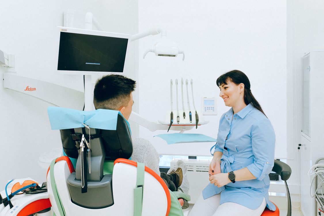 Dentist consulting with a patient at Life Smile Dental Center